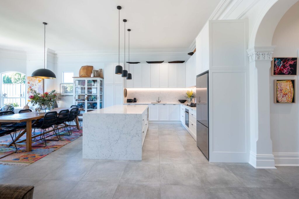 This Kitchen is classic and elegant in its alignment to the architectural features of the home. The versatility and location create a perfect family space.