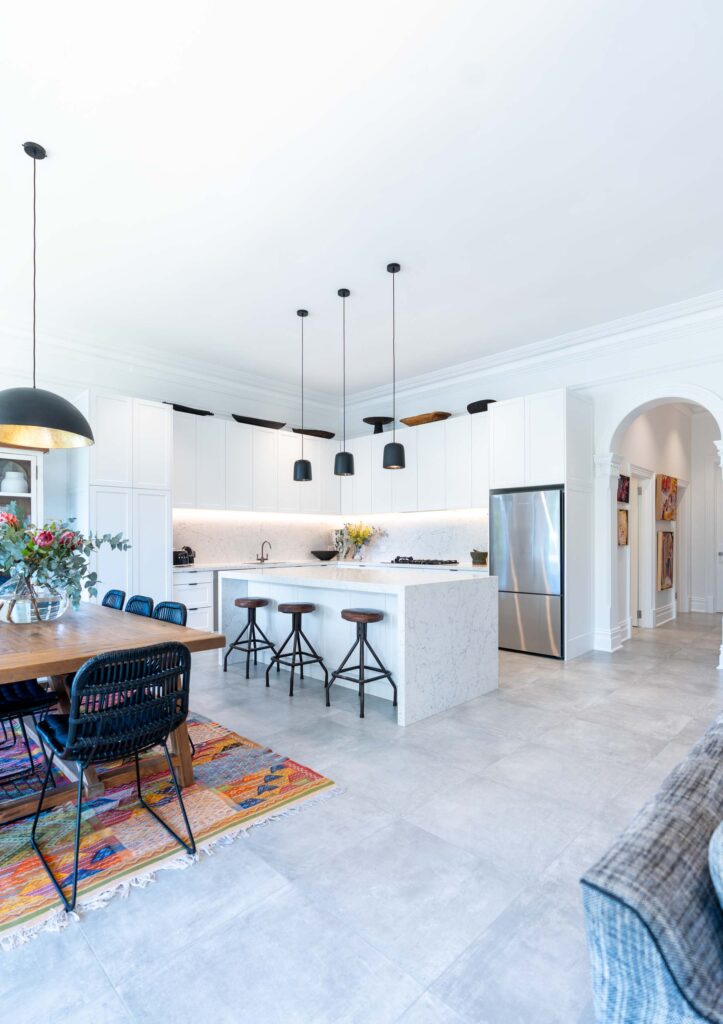 The Open plan dining and kitchen creates the foundation of the home. The cabinetry is the hero, a tradtional shaker style profile door , thermolaminated in premium white.