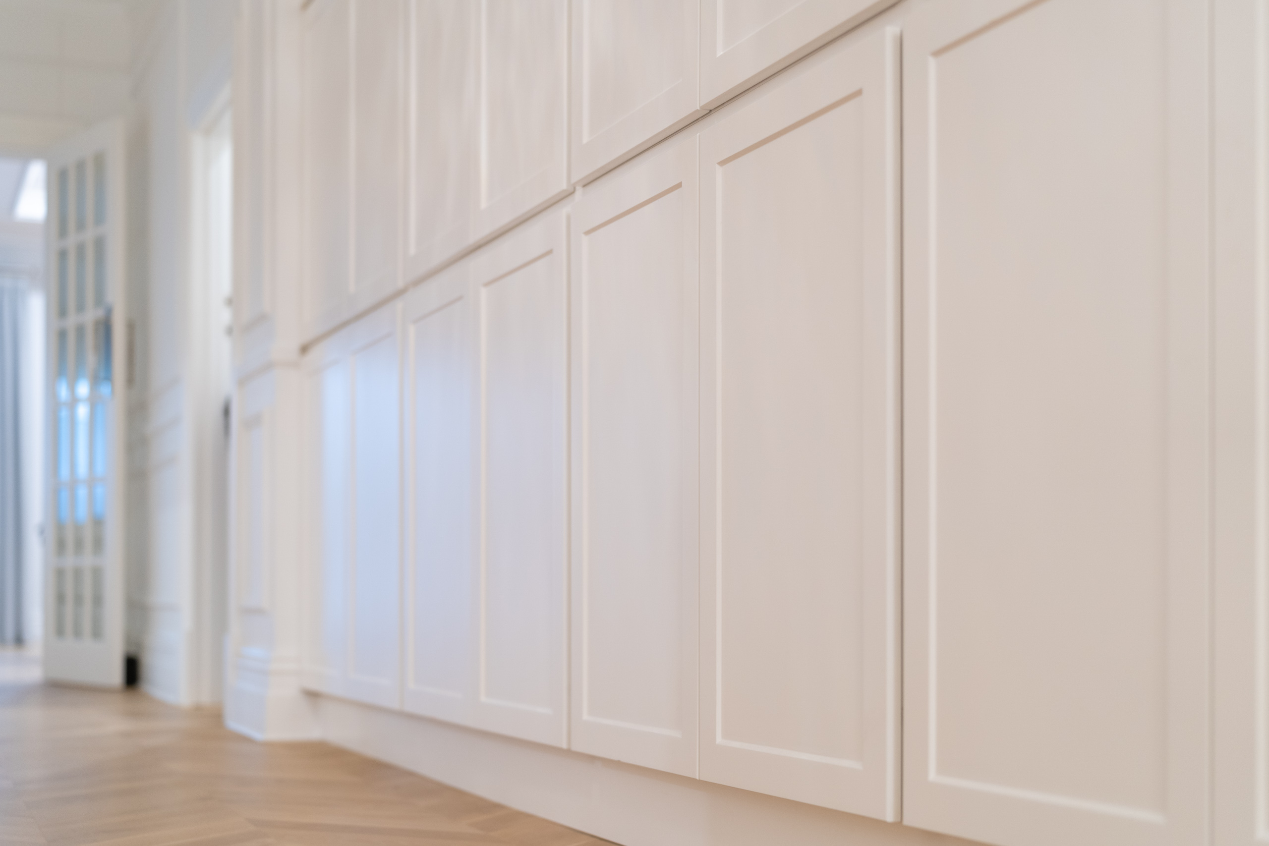 Barossa profile white grey hallway storage wall with herringbone floor.