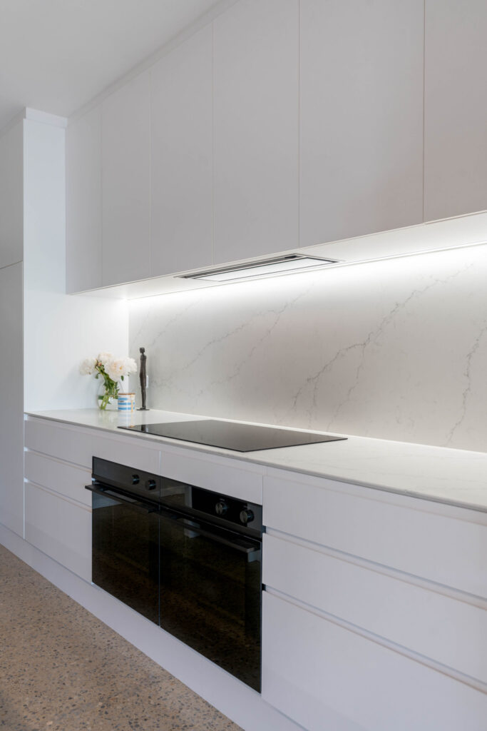 Benchtop like Zenith Marbella. with double oven and cooktop with splashback.