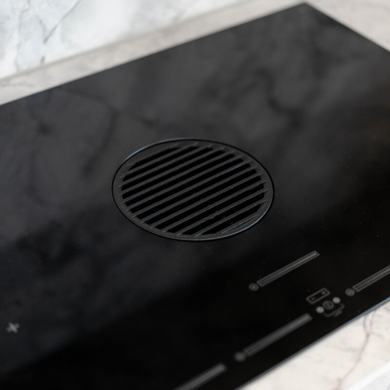 Fisher and Paykel down draft induction cooktop. Kitchen delicately organic.