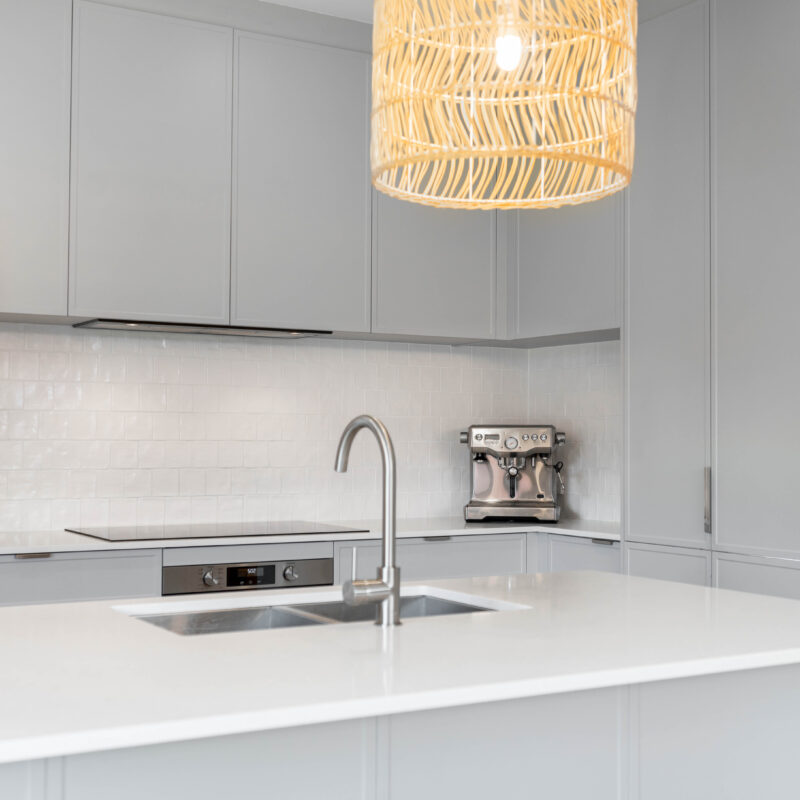 Kitchen Pearl Grey soft coastal Kiev 20 profile. L shaped. With natural pendant light