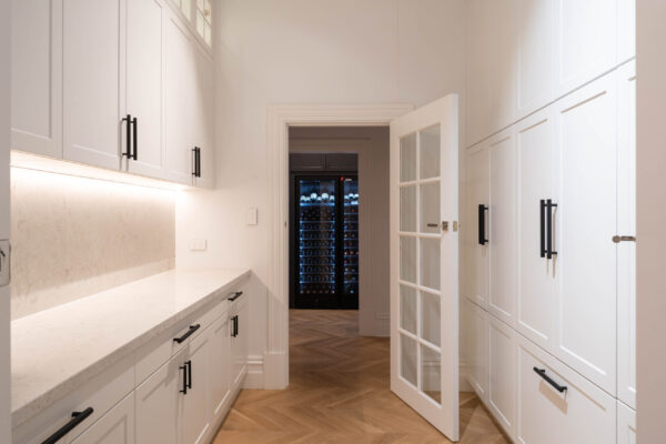 Walk in Butlers pantry and laundry that goes into the wine room.