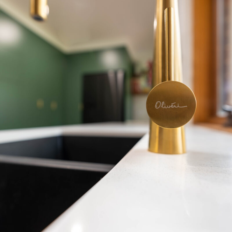 Gold Oliveri goose neck tap.