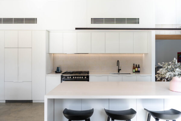 An open Simply Stylish Kitchen space. With Multiple profiles and black accents.