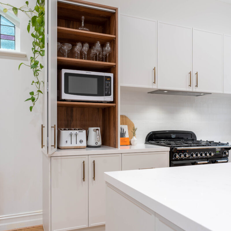 Farmhouse kitchen. White grey Farquhar Suedette matte Kiev 20 L shaped kitchen with Timber internal hidden nook for small appliances.