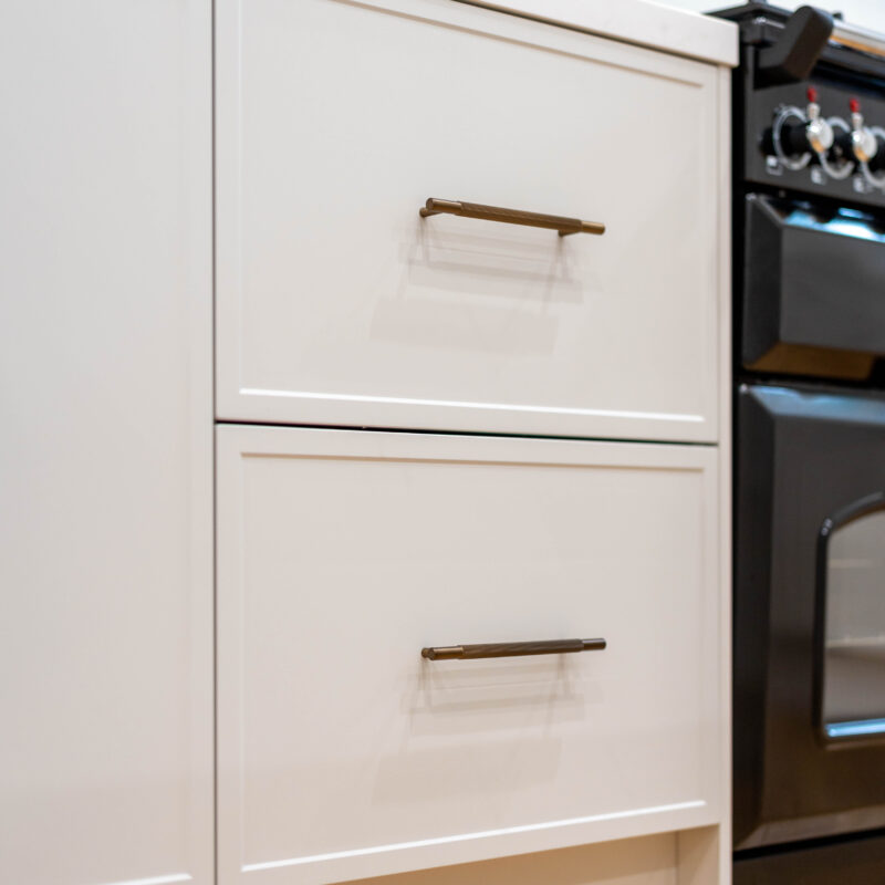 Farquhar Kiev Profile 20 white grey draw units with tradtional bronze handles.