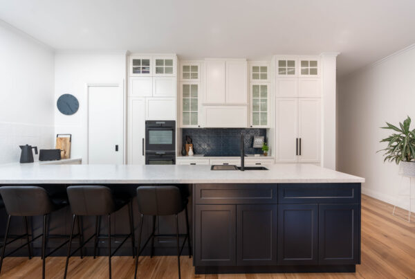 Kitchen, Hamptons inspired with navy island and glass paneled white cabinetry.