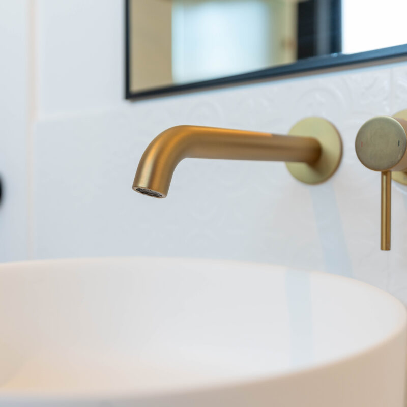 Gold Tapware with bowl on embossed white tile