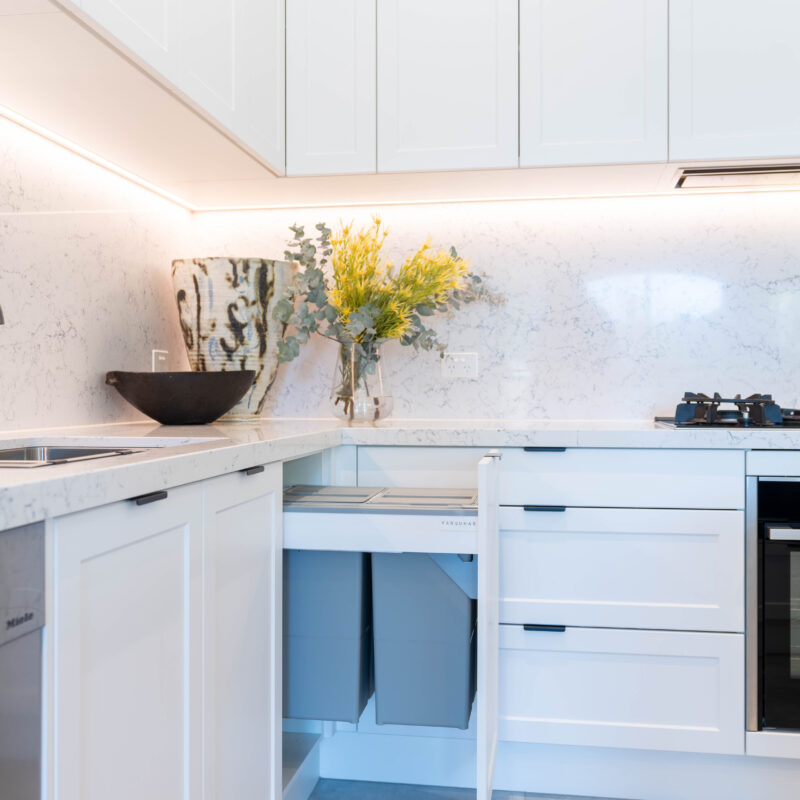 This Kitchen is a traditional shaker style. Profile door in white with hidden bin draw and cabinet.