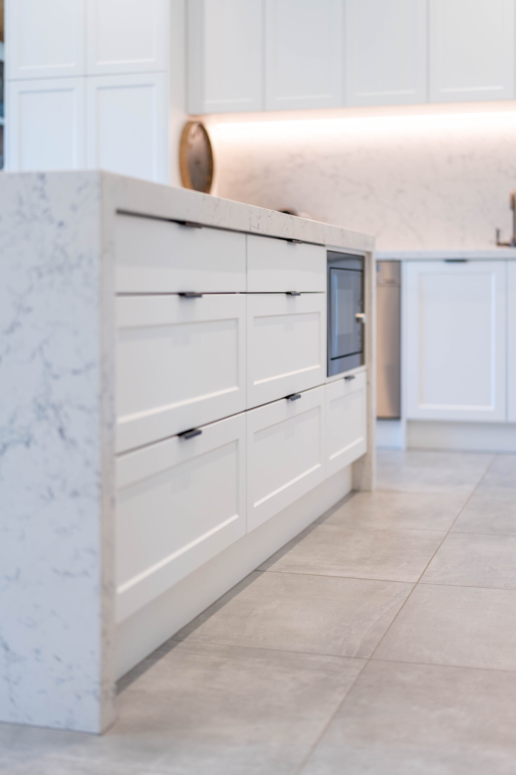 The Kitchen Island. Versatile large draws in Barossa profile cabinetry. Grey tones benchtop in zenith Carrara mist style