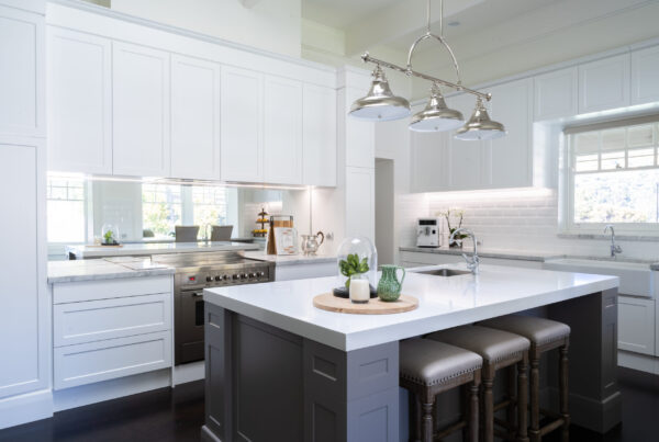 Kitchen. Hamptons style. Farquhar Barossa profile in white with white beveled edge subway tiles and large colored island and mirror splashback. Industrial and traditional.