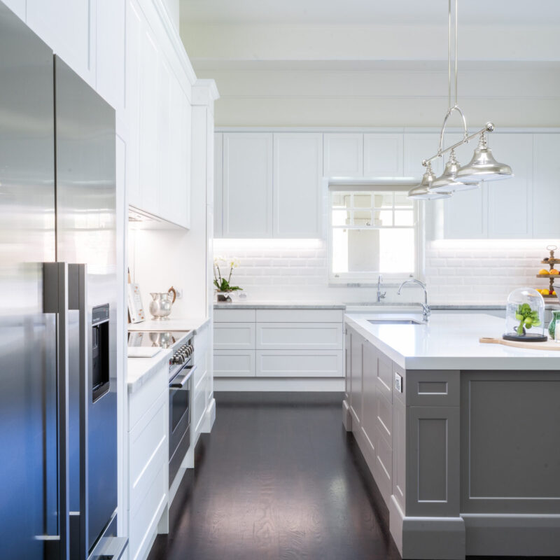 Open, wide and bright with traditional features a Hamptons classic kitchen.. With white, silver and grey tones.