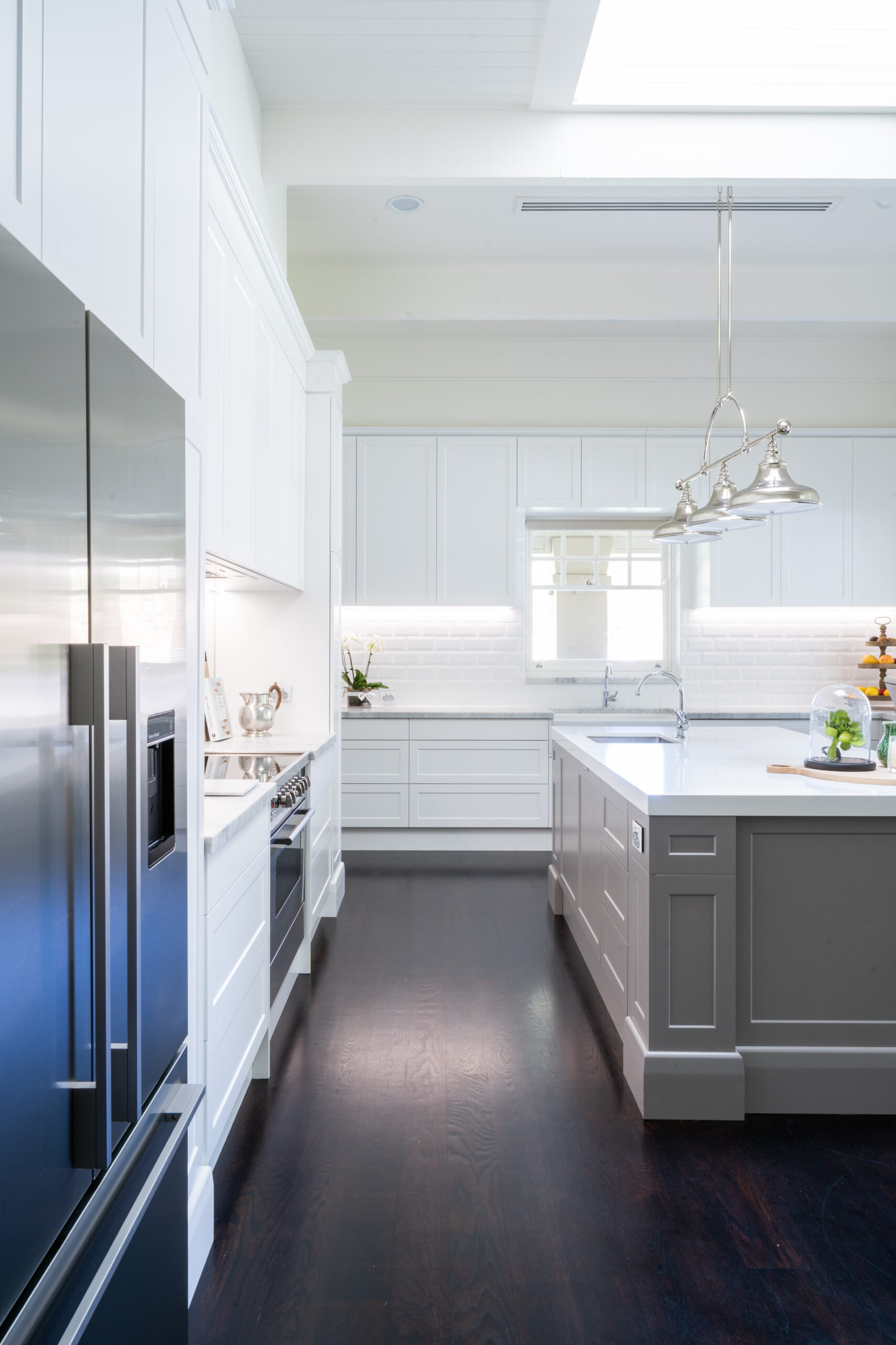 Open, wide and bright with traditional features a Hamptons classic kitchen.. With white, silver and grey tones.