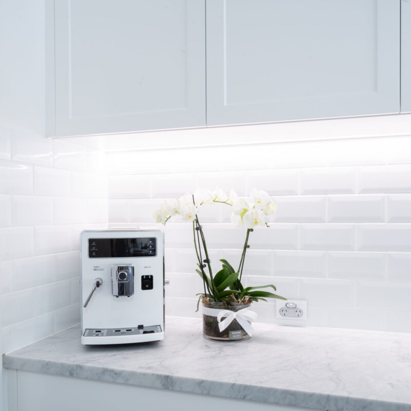 Butlers pantry with white subway tiles and coffee machine space with cabinetry in Farquhar Barossa profile win a crisp white.
