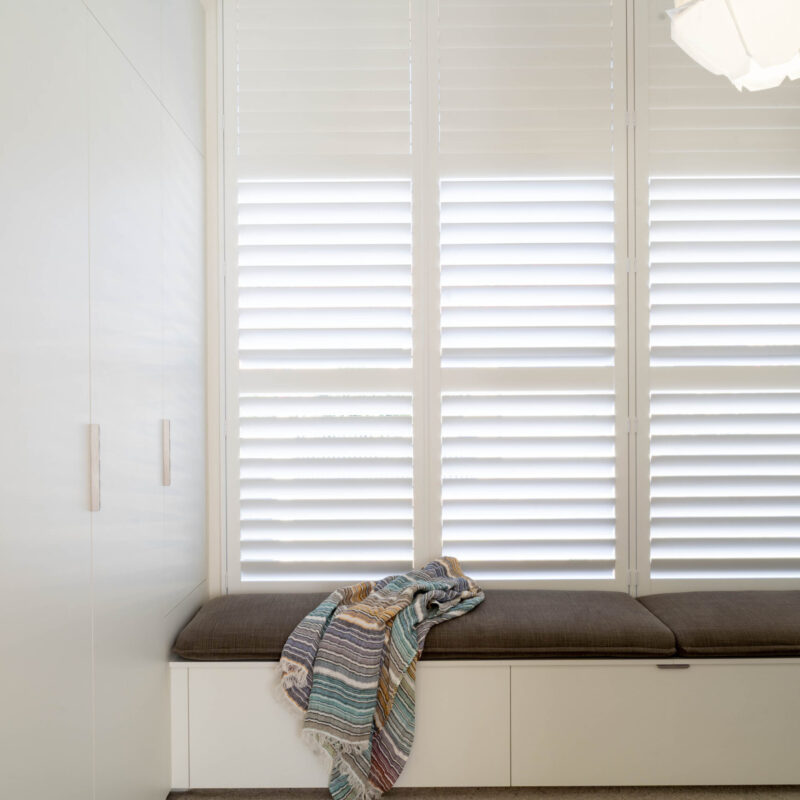 Walk in Robe. The master walk-in robe makes getting ready a dream, fitted out with cool matte white robes on either side, a large vanity mirror and a cosy bench seat by the window with even more storage underneath.