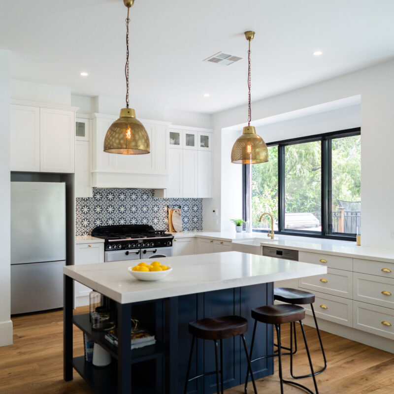 Traditional twist Kitchen. Navy, white and gold, with tradtional highlights, open and spacious for entertaining.