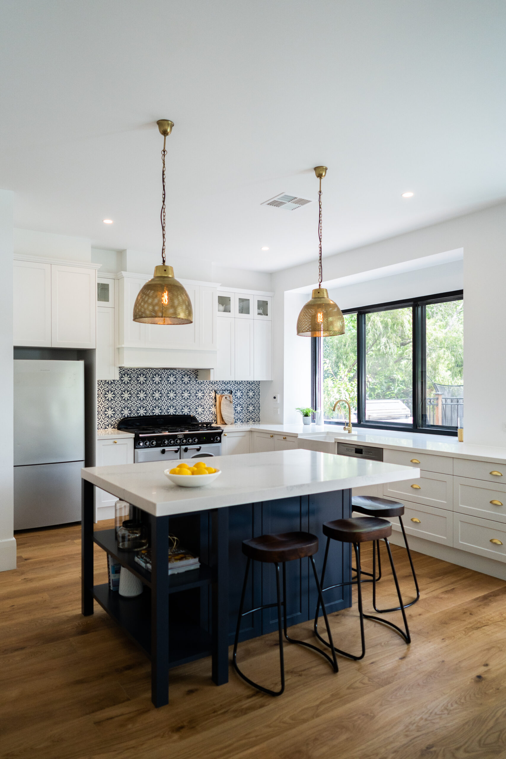Traditional twist Kitchen. Navy, white and gold, with tradtional highlights, open and spacious for entertaining.