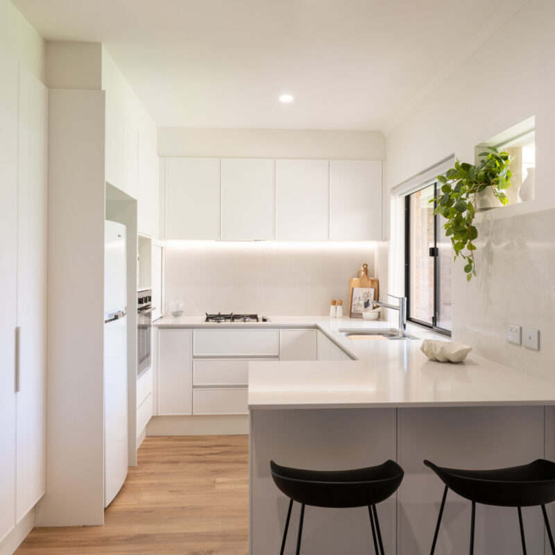 Kitchen. Farquhar Kiev 10 profile, white and fresh. G shape with lots of storage with natural highlights.