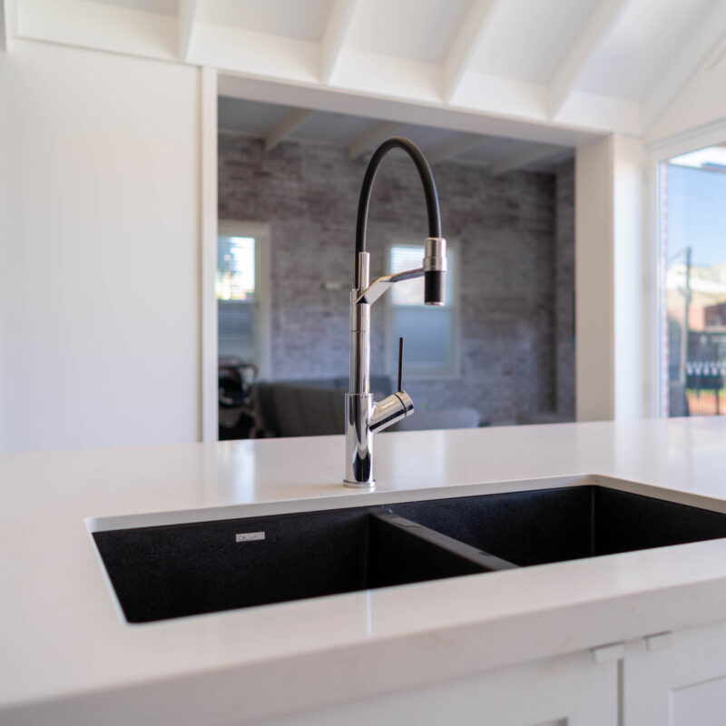 Oliveri Santorini sink and Vilo tap in black to contrast the crisp white elements.