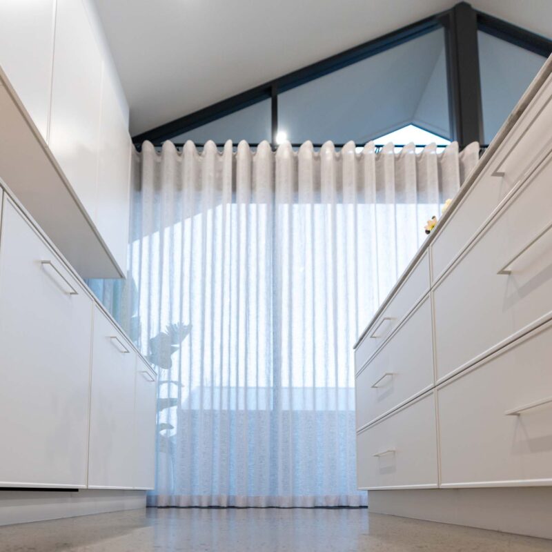 Galley-style kitchen with white slim shaker cabinet doors and drawers