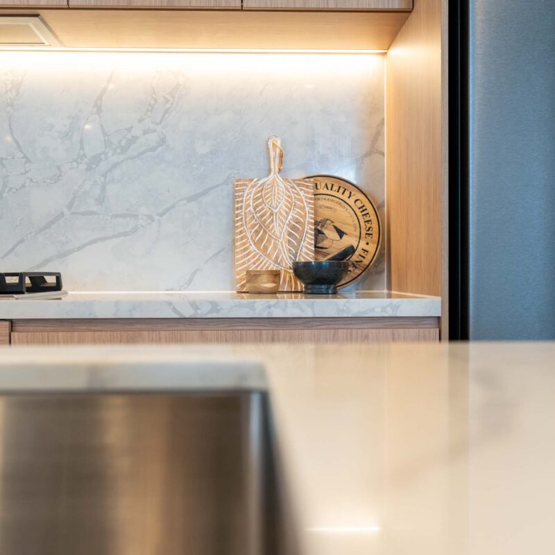 Grey marble splashback with matching benchtop.