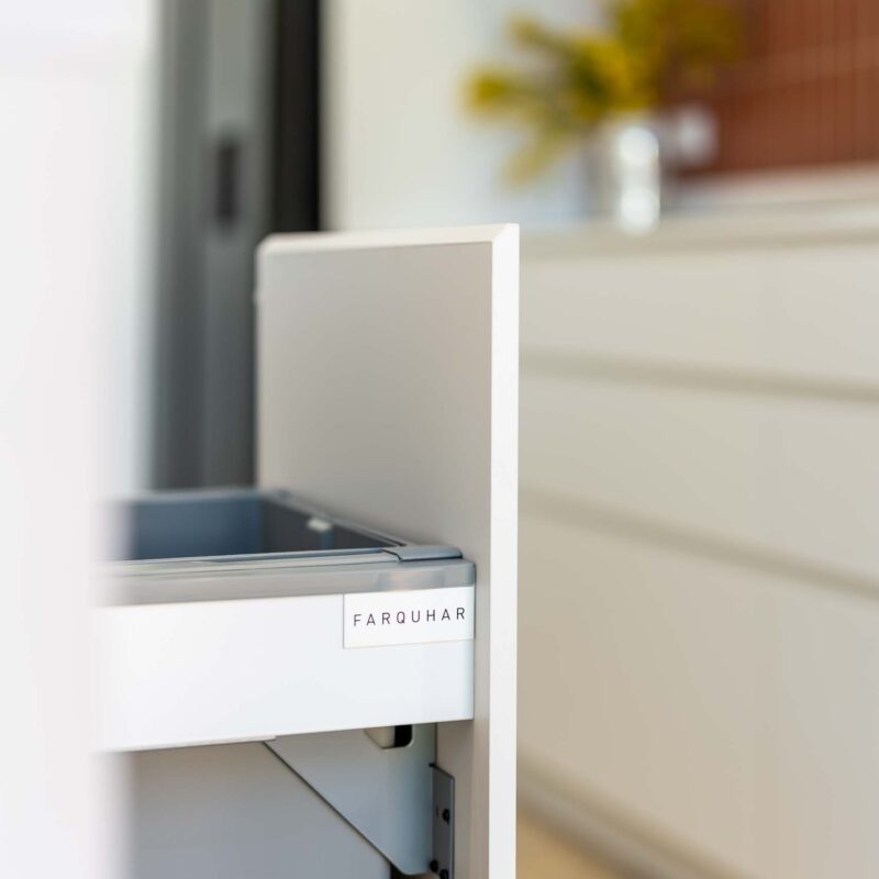 White finger pull integrated pull out bin.