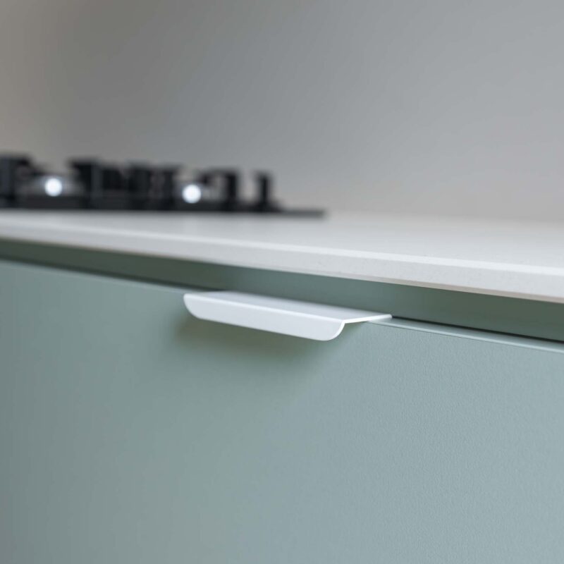 Matte green base drawer showing a lip pull handle.