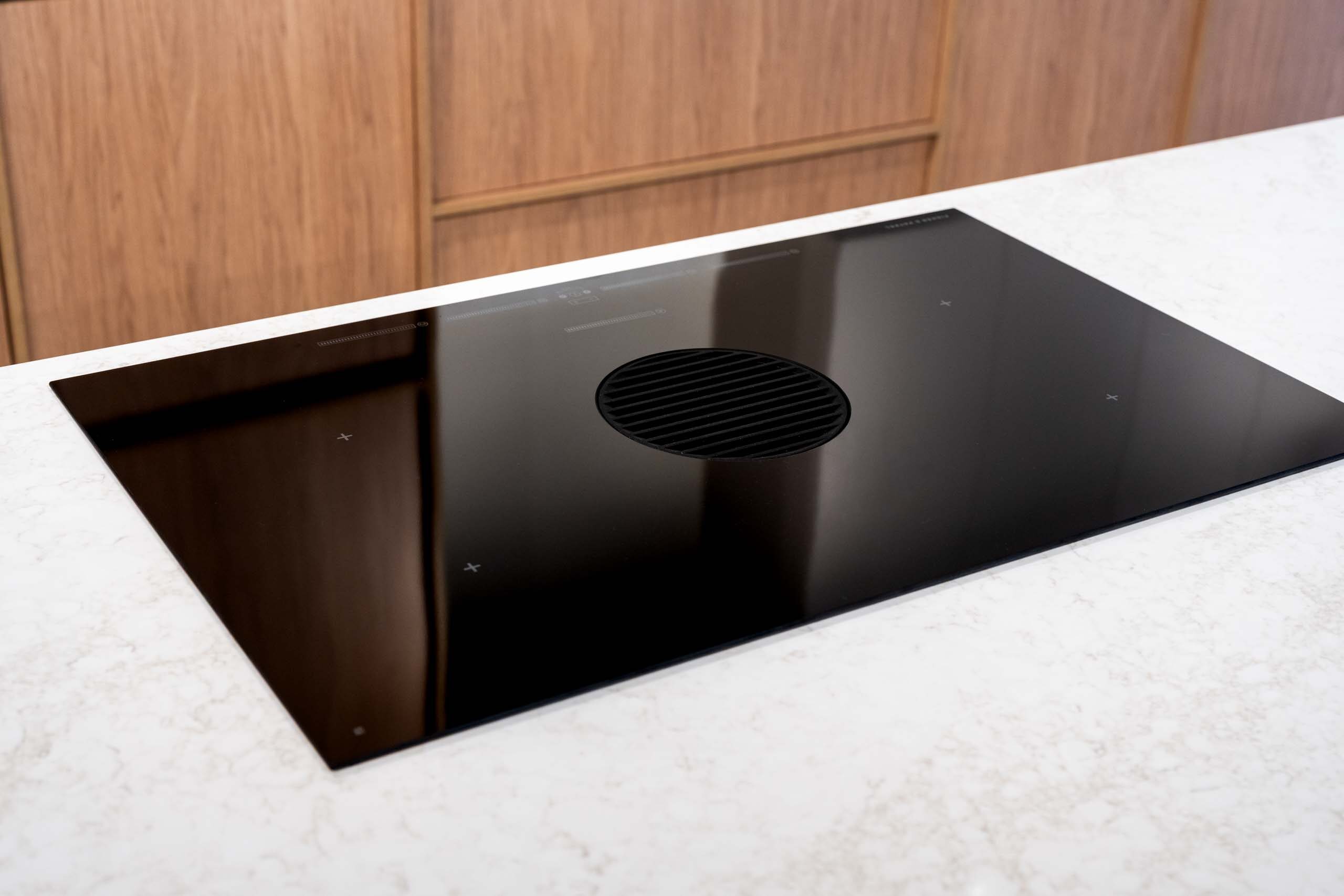 Fisher & Paykel cook top featuring a down draft.