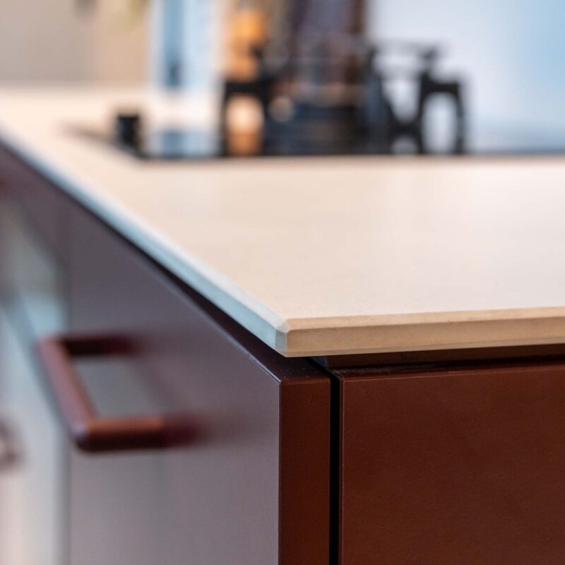 Small kitchen with Kalamata laminate cabinets and a light 12mm Dekton Aeris benchtop.