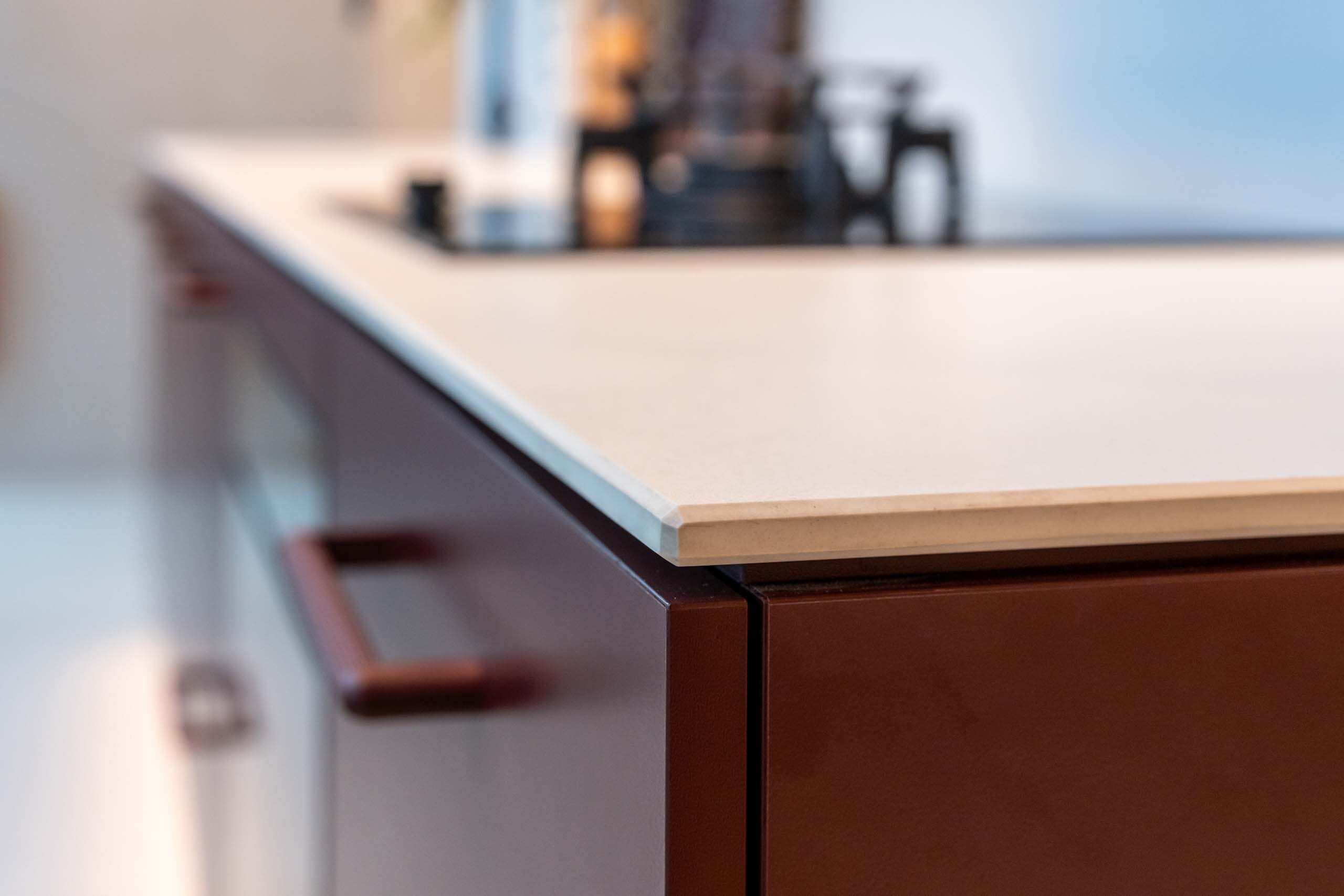 Small kitchen with Kalamata laminate cabinets and a light 12mm Dekton Aeris benchtop.