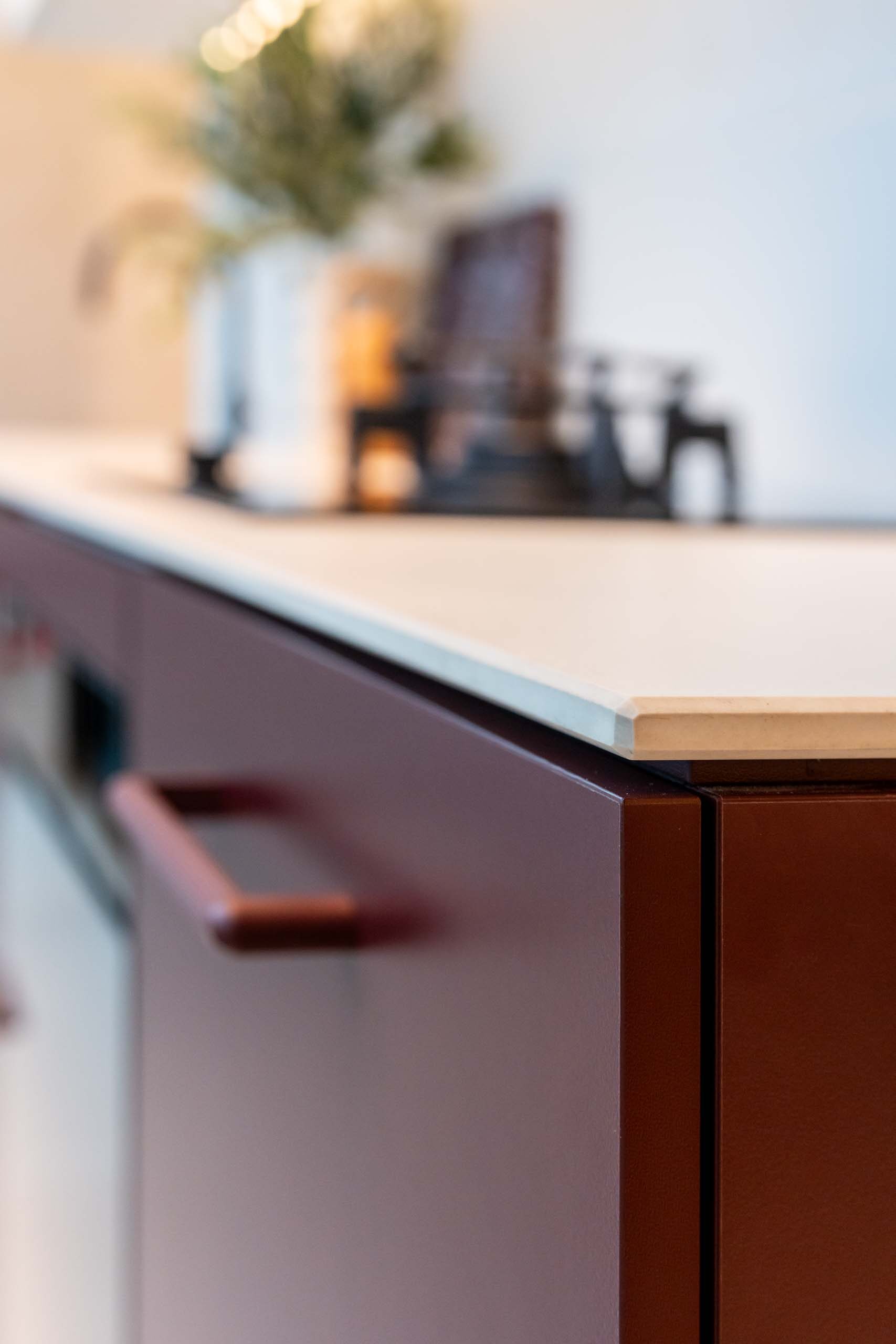 Small kitchen with Kalamata laminate cabinets and a light 12mm Dekton Aeris benchtop.